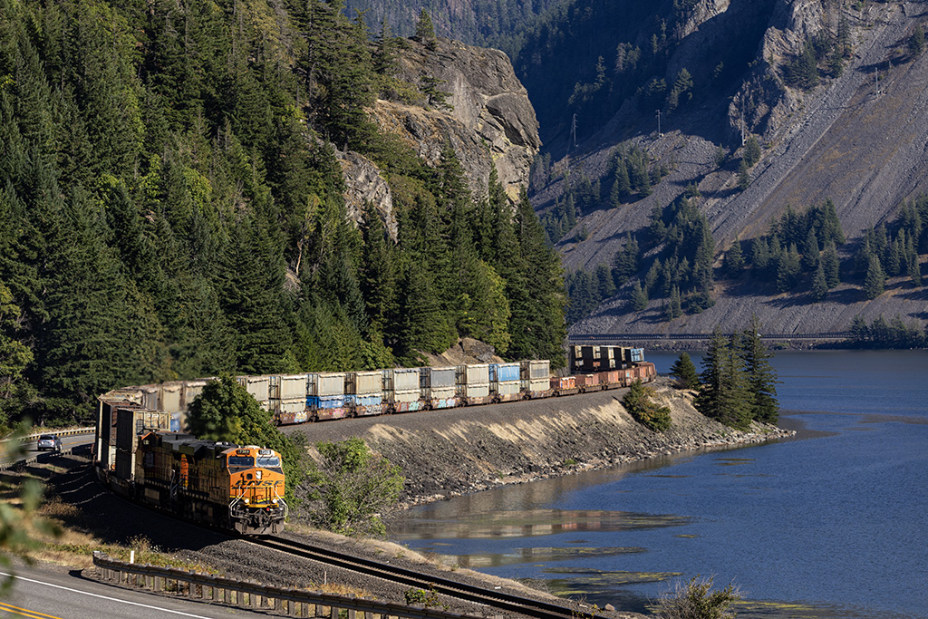 An empty BNSF trash train heads west along the rugged Columbia near Home Valley, Washington, August 21, 2025. Photo by Mike Yuhas
